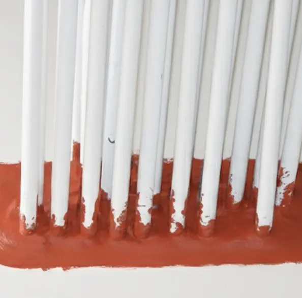 Image of fire stop material installed in pipe wall penetration.